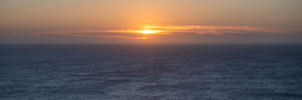 Panorama midsummer sunset looking North West from Eshaness Lighthouse, Shetland to the open Atlantic