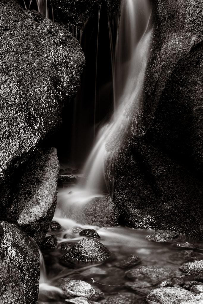 Monochrome small waterfall at Burn O'Vat, Dinnet, Aberdeenshire