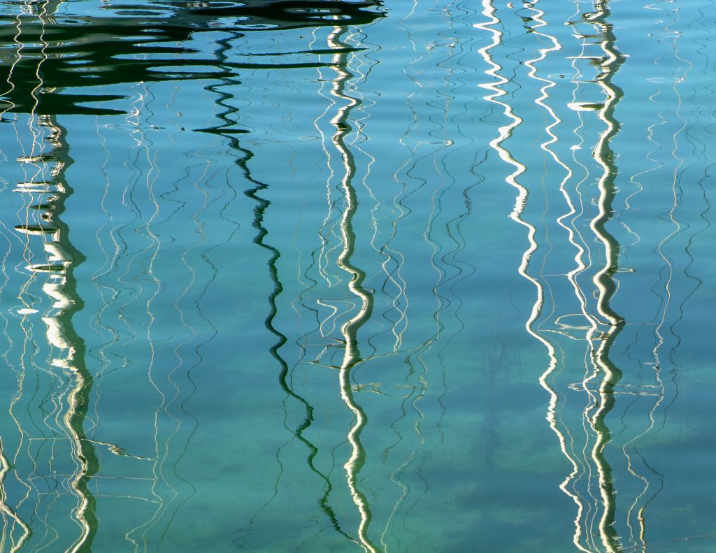 Detail of yacht masts reflected in Lerwick Harbour, Shetland