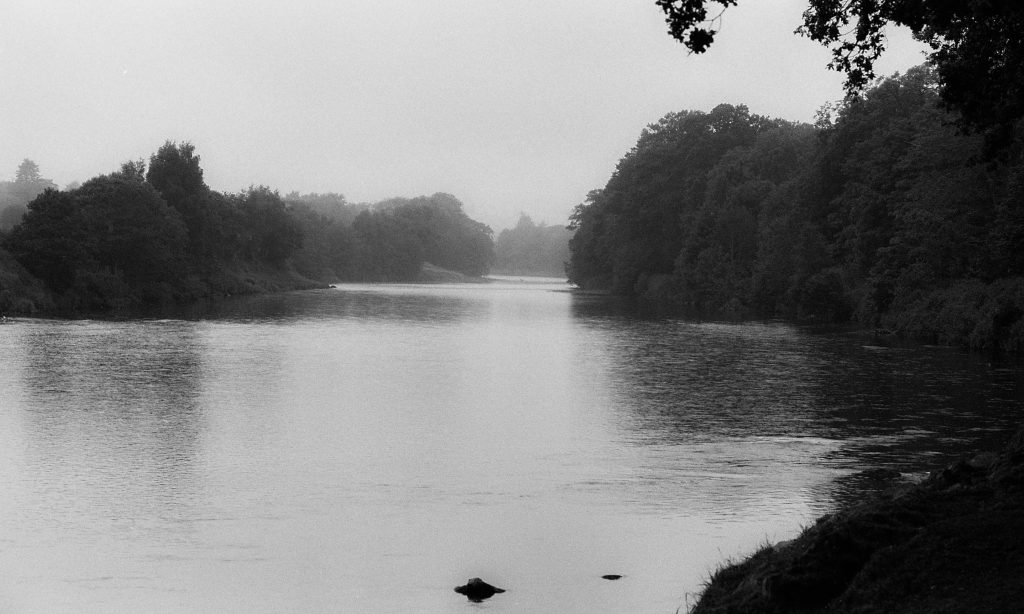 Black and white film photograph of the River Dee in Banchory, Scotland