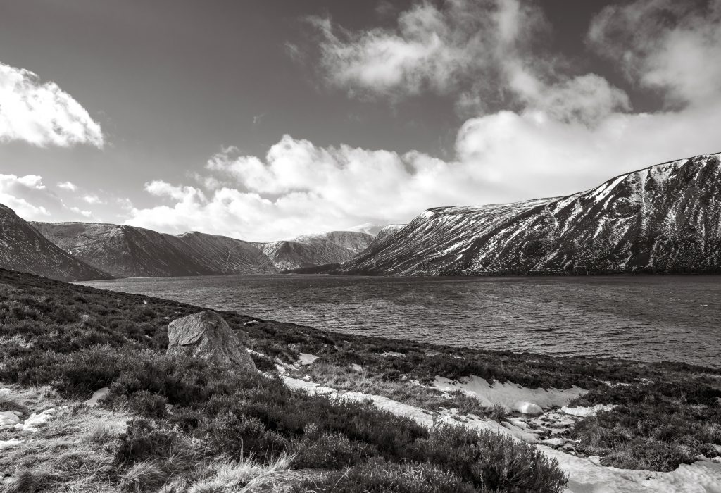 Monochrome winter landscape of Loch Muick on the Balmoral Estate, Scotland